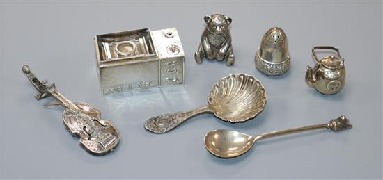 Small silver and white metal items including tea kettle on cooker, caddy spoon, miniature fiddle, spoon with dogs head terminal etc.